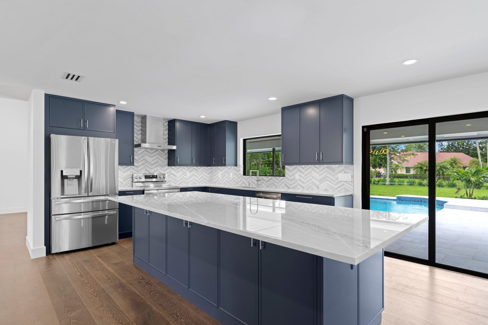 Completed kitchen renovation with navy cabinetry